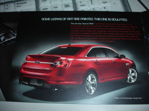 1993 Ford Taurus - This red sedan is presented as a "sculpted" work of art in a brochure.