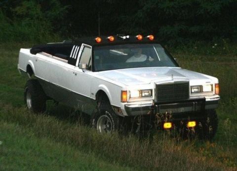 1988 Mercury Grand Marquis - This heavily modified Lincoln Town Car has been converted into a pickup truck with a lifted suspension.