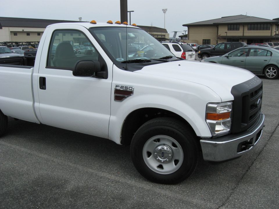 White Ford F-250 Super Duty regular-cab pickup in a parking lot
