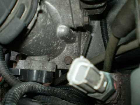 1996 Ford Bronco - Engine component detail with visible wiring harness and connector.