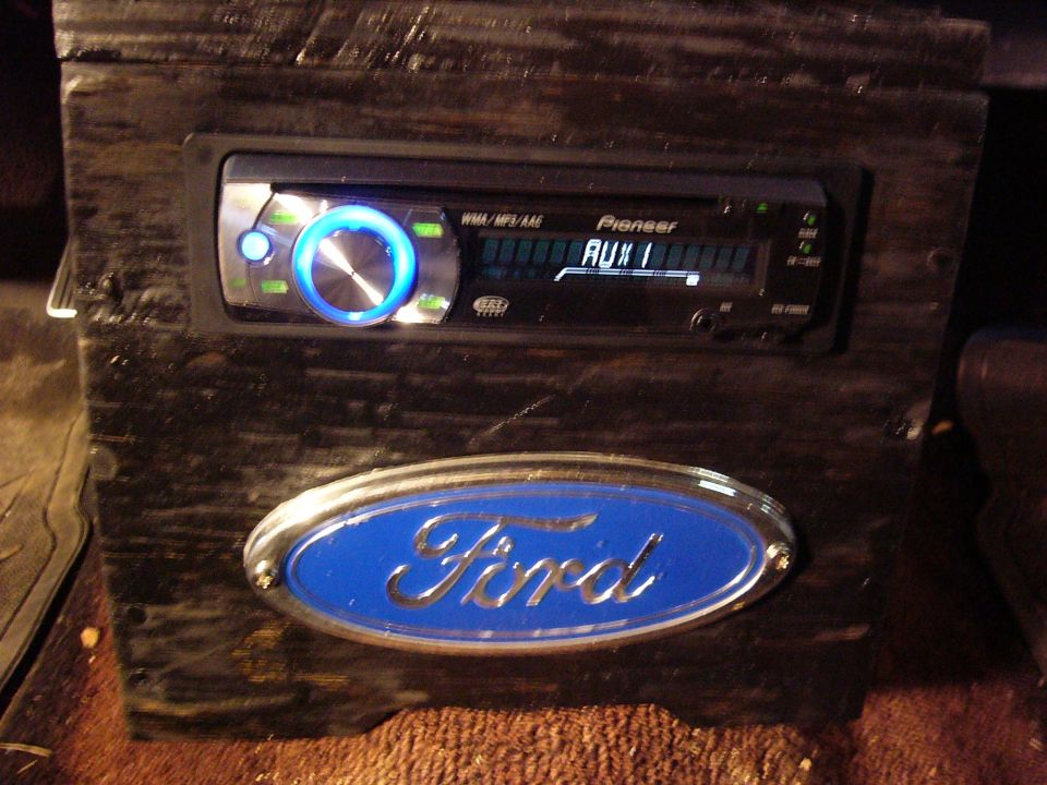 Ford emblem on wooden console with Pioneer stereo