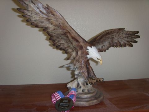 1978 Ford Bronco - A detailed eagle statue is displayed with a medal that reads '2008 Maintenance Professional'.