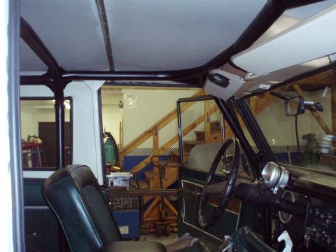 1977 Ford Bronco - The interior of a Ford Bronco shows a roll cage and the dashboard area.