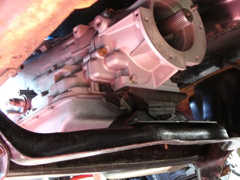 1978 Ford Bronco - Underside view of a vehicle's transmission and driveshaft, showing mechanical components.