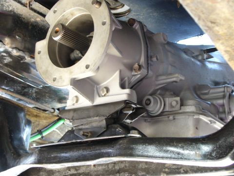 1978 Ford Bronco - Close-up view of a vehicle's transmission and driveshaft components.