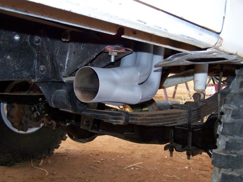 1995 Ford Bronco - Close-up view of the undercarriage and exhaust system of a vehicle.