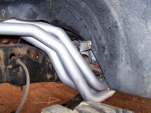 1995 Ford Bronco - New exhaust headers are installed on the underside of a vehicle.