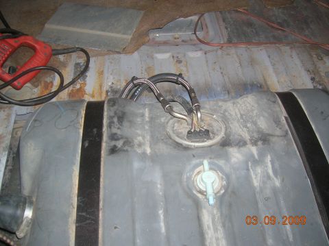 1985 Ford Bronco - lines hooked back up...rubber fuel line wrapped around the steel braiding for portection.