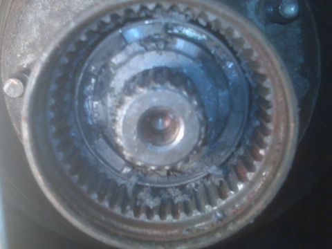 1995 Ford Bronco - A close-up view of a wheel hub assembly, showing internal gears and wear.