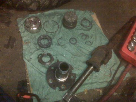 1995 Ford Bronco - Axle parts are laid out on a cloth, ready for assembly or repair.