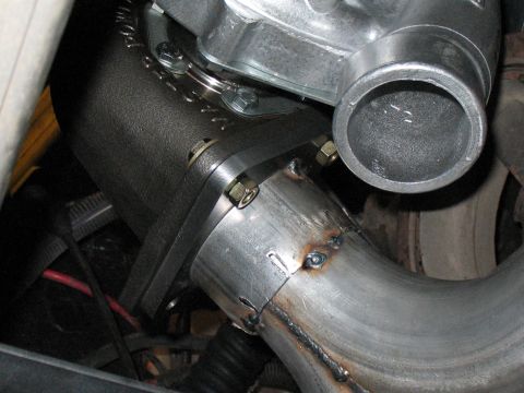 2001 Pontiac Trans Am - Close-up view of custom exhaust piping connected to a turbocharger, showing welding details.