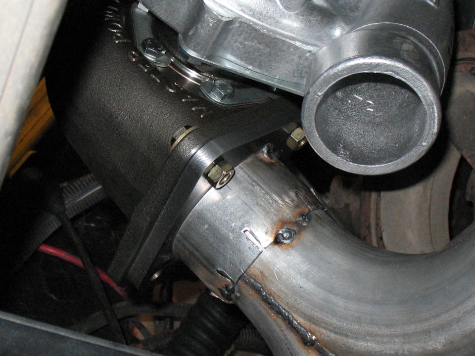 Turbocharger exhaust piping with visible welds
