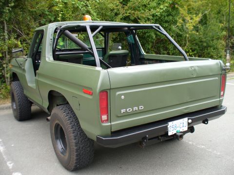 1978 Ford Bronco - Rear view of a 1978 Ford Bronco, a roll cage and aftermarket bumper.