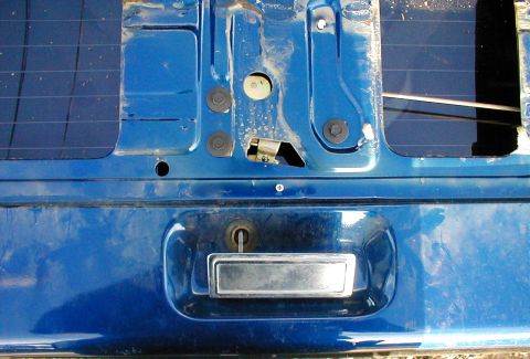 1983 Ford Bronco - The 3 black bolts hold the center latch mechanism (remote control) and are used to align it so the handle lies flat, and the latches open a…