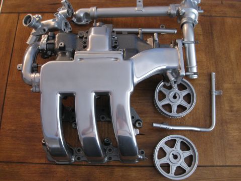 1994 Ford Probe - This image displays an engine's intake manifold and associated parts, not a 1994 Ford Probe.