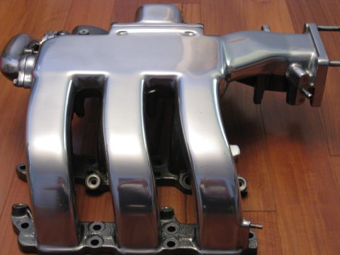 1994 Ford Probe - This is a polished aluminum intake manifold, likely a performance upgrade part.