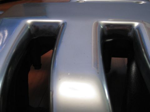 1994 Ford Probe - This is a close-up view of a silver engine valve cover, showing two distinct openings.