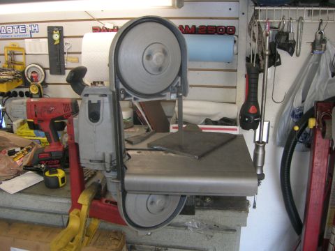 1996 Ford Bronco - A band saw is shown with a metal plate on its cutting surface, ready for fabrication.