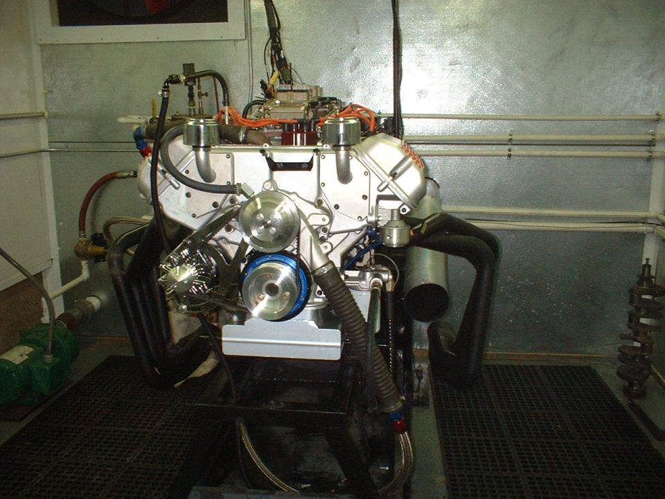 Engine on a test stand with exhaust headers and intake manifold