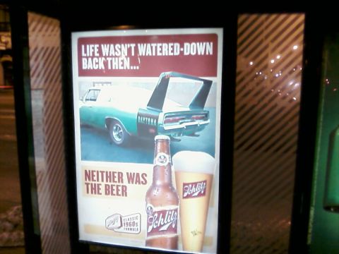 1985 Ford LTD Crown Victoria - Advertisement a 1970 Dodge Charger Daytona and Schlitz beer, stating 'Life wasn't watered-down back then... neither was the beer.'