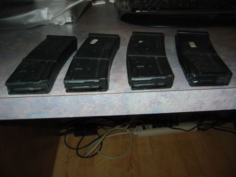 1996 Ford Bronco - Four rifle magazines are lined up on a speckled countertop, with a keyboard visible in the background.