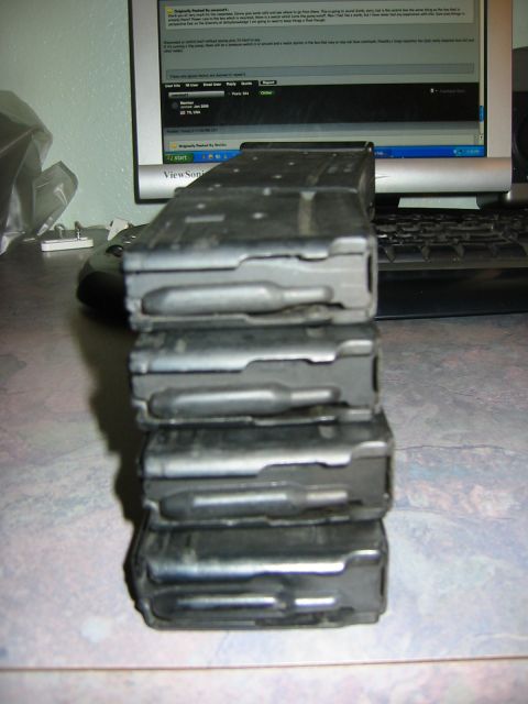 1996 Ford Bronco - A stack of rifle magazines is shown in front of a computer screen.