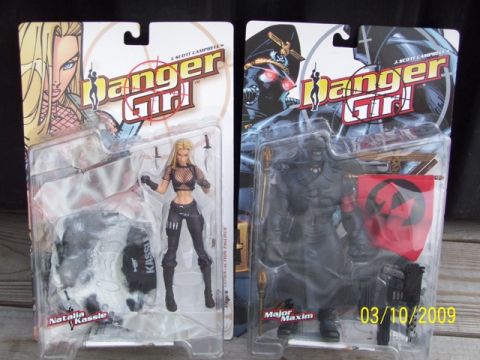 1991 Ford Bronco - Two Danger Girl action figures, Natalia Kassie and Major Maxim, are displayed in their original packaging.