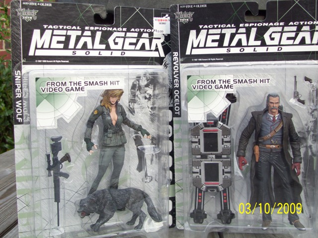 Two Metal Gear Solid action figures, Sniper Wolf and Revolver Ocelot, in packaging