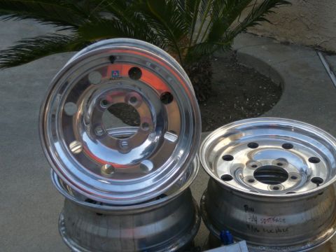 1988 Ford Bronco - Polished aluminum wheels are stacked, with one showing an ALCOA logo.