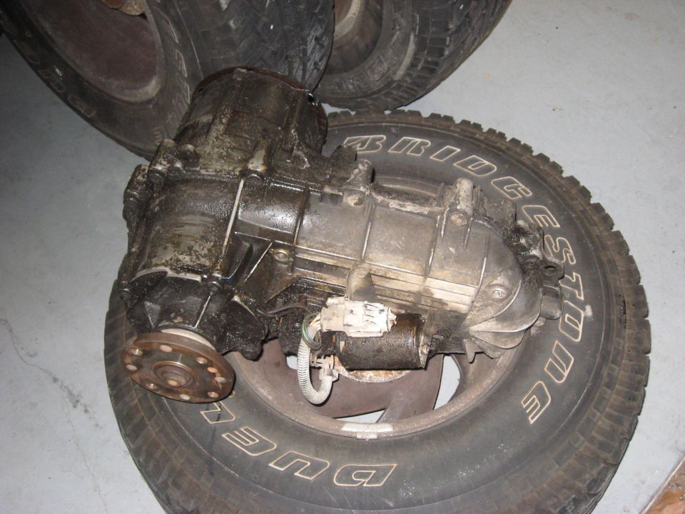 transfer case sitting on a tire