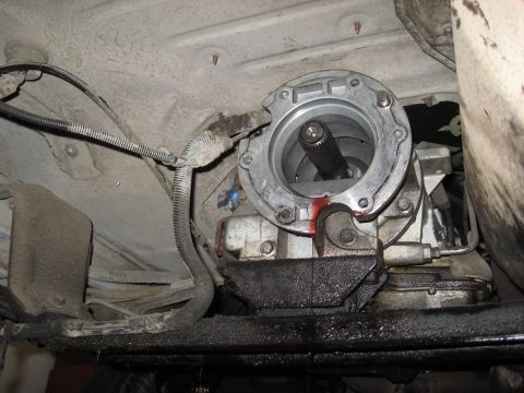 1991 Ford Bronco - Underside view of a vehicle's transfer case with a visible fluid leak.