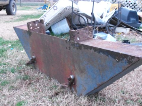 1983 Ford Ranger - A close-up view of a heavily rusted metal bumper part, showing signs of blue and red paint.