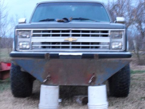 1983 Ford Ranger - This truck's front end is shown, a custom bumper and resting on white buckets.