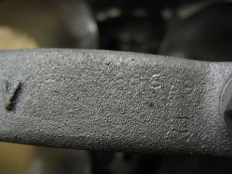 1972 Ford Ranchero - A close-up view of a metal component shows stamped alphanumeric characters, indicating a part number or identification mark.