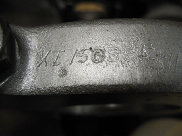 Metal casting with stamped numbers XL/15088-51