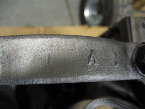 1972 Ford Ranchero - A close-up view shows stamped numbers on a metal component, possibly from a vehicle part.