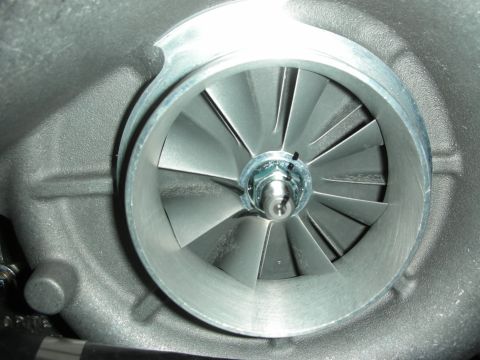 1998 Ford Crown Victoria - Close-up view of a turbocharger's compressor wheel.
