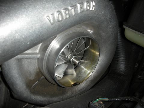 1998 Ford Crown Victoria - A Vortech supercharger is shown, with its impeller and housing clearly visible.