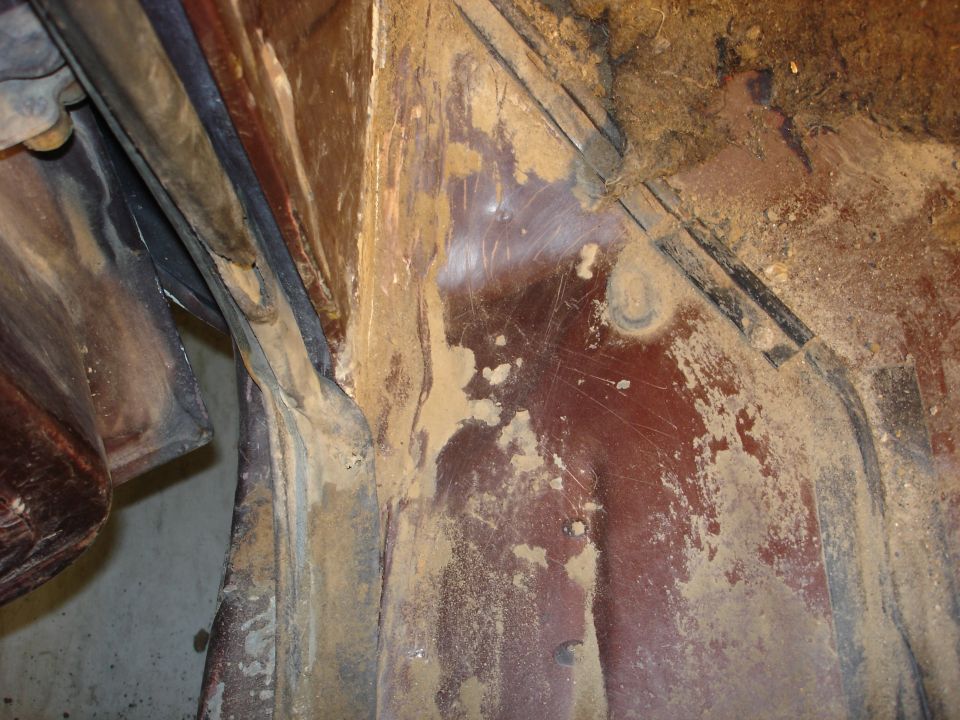 Interior body panel covered in dirt and grime