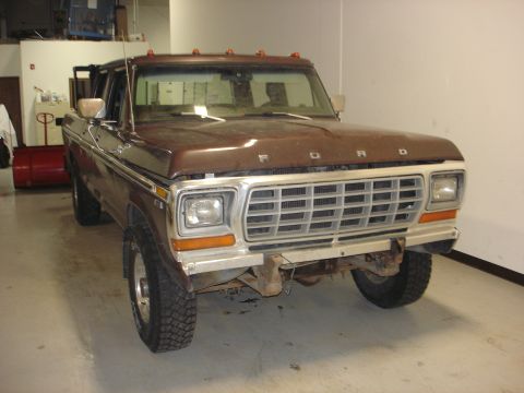 1979 Ford F-250 - This 1979 Ford F-250 crew cab pickup truck is shown from the front in a garage setting.