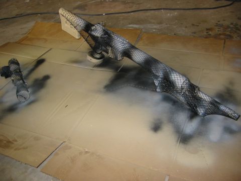 1996 Ford Bronco - Car part undergoing camouflage paint job with mesh stencil.