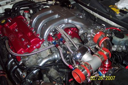 1994 Ford Probe - Custom engine modifications including intake and exhaust systems are visible in this engine bay.