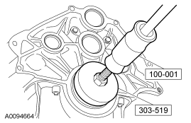 2007 Ford Mustang - Service procedure illustration showing tools 100-001 and 303-519 used to remove a bushing or seal from a housing.