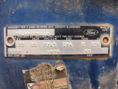1985 Ford Bronco - A close-up of a Ford VIN plate affixed to a blue vehicle. The plate contains vehicle identification numbers, warranty information, and the…