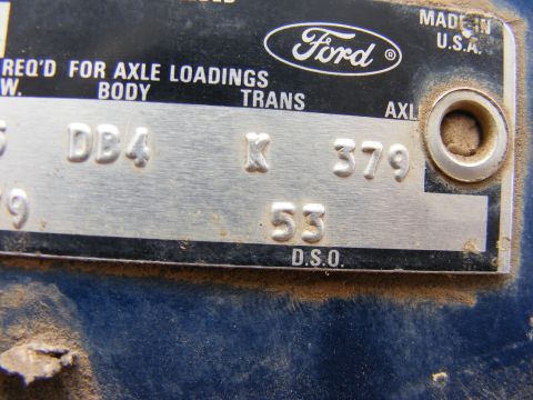 1985 Ford Bronco - A close-up of a metal data plate on a vehicle, featuring the Ford logo and stamped information including 'REQ'D FOR AXLE LOADINGS', 'BODY',…