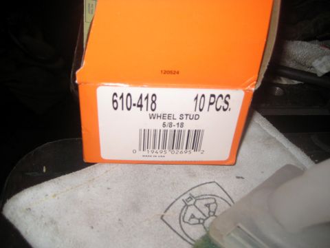 1996 Ford Bronco - A close-up shot of an orange box labeled "610-418 WHEEL STUD 5/8-18 10 PCS.". The box also has a barcode and "MADE IN USA" printed on it.