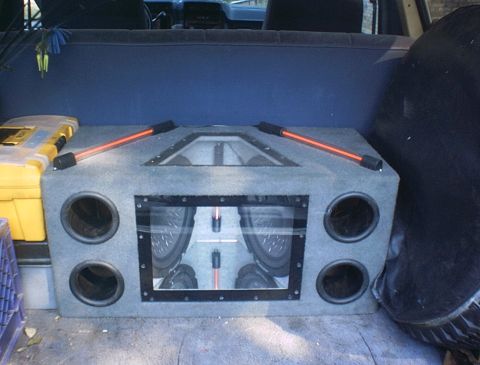 1986 Ford Bronco - 2 Pioneer 12" subs in a Banpass box, powerd by a elcheepo amp that was tweaked to 532 watts rms. I have it set at 3/4 gain.