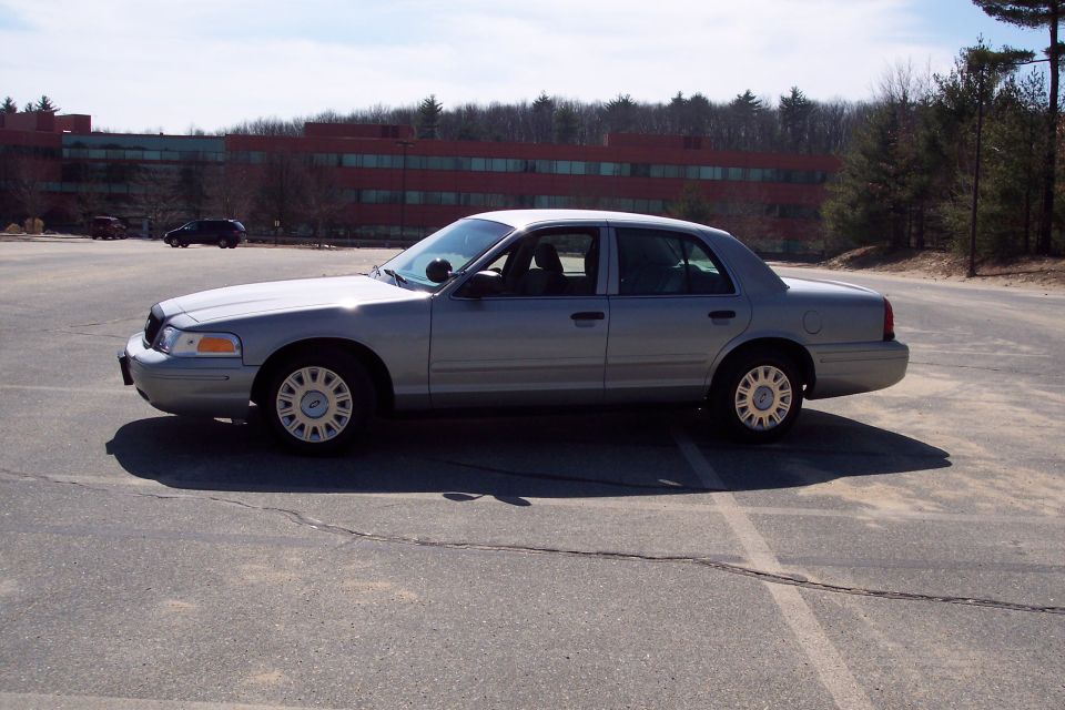 2001 Ford Crown Victoria sedan parked in a lot, side view