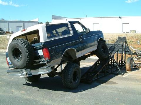 1993 Ford Bronco - This 1993 Ford Bronco is shown on a metal ramp, with a spare tire mounted at the rear.