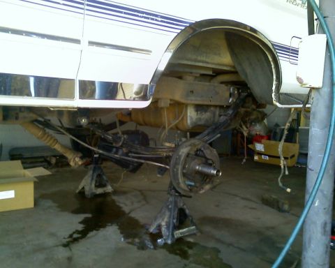 1996 Ford Bronco - Rear axle of a 1996 Ford Bronco is raised on jack stands for maintenance.